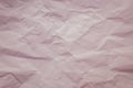 Cream paper background. Pastel, soft pink color. Vintage texture of creased sheet. Painted crumpled page, pattern. Copy space. Lig