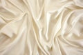 cream satin grouped in broad, soft folds