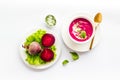 Cream soup made of red beet with raw beet roots Royalty Free Stock Photo