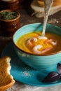 Cream soup with shrimps and a toast Royalty Free Stock Photo