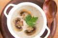 Cream soup in a white plate. Mushroom soup. Potato soup with mushrooms. Top view, wooden background Royalty Free Stock Photo