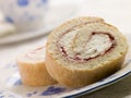 Cream and Strawberry Sponge Roll with Tea