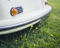 Cream vintage car in a meadow