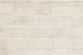 Cream and white brick wall texture background. Brickwork or stonework flooring interior rock old pattern clean concrete grid Royalty Free Stock Photo