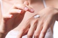 Cream on the women hand Royalty Free Stock Photo