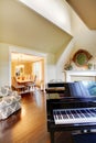 Cream yellow living room with grand piano.