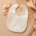 CreamColored Baby Bib with Pacifier and Accessories Royalty Free Stock Photo