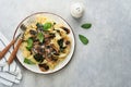 Creamy Alfredo pasta. Italian pasta fettuccini with mushrooms, chicken meat, spinach, basil and cream sauce on grey stone or Royalty Free Stock Photo