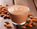 Creamy almond nut butter in a glass jar delicious and healthy spread made from roasted almonds