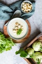 Creamy celery and kohlrabi soup topped with croutons