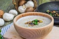 Creamy Champignon Soup in Wooden Bowl with SautÃÂ©ed Champignon M