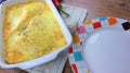 Creamy cheesy tortilla baked dish with ground meat and mozzarella cheese for a family dinner