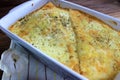 Creamy cheesy tortilla baked dish with ground meat and mozzarella cheese for a family dinner