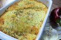 Creamy cheesy tortilla baked dish with ground meat and mozzarella cheese for a family dinner