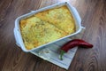 Creamy cheesy tortilla baked dish with ground meat and mozzarella cheese for a family dinner