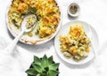 Creamy chicken breast, cauliflower, leek pie with crispy potato cheese topping on light background, top view Royalty Free Stock Photo