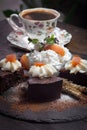 Creamy chocolate cake with apricot jam, whipped cream and cup of coffee Royalty Free Stock Photo