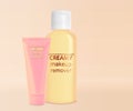 Creamy cleansers on beige background. Makeup remover