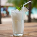 Creamy Coconut Cocktail with Mint on Wooden Table Royalty Free Stock Photo