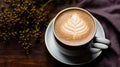 creamy coffee cup and coffee beans as the backdrop, offering a delicious and aromatic experience. Royalty Free Stock Photo