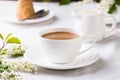 Creamy Coffee in white mug with apple blossom Royalty Free Stock Photo