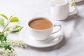 Creamy Coffee in white mug with apple blossom Royalty Free Stock Photo
