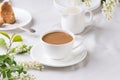 Creamy Coffee in white mug with apple blossom Royalty Free Stock Photo