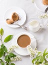 Creamy Coffee in white mug with apple blossom Royalty Free Stock Photo