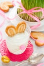 Creamy dessert with cookies in glass in the form of Easter bunny