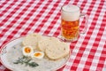 Creamy dill sauce with slices of czech dumpling, soft boiled egg and glass of pilsner beer Royalty Free Stock Photo