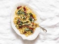 Creamy fettuccine pasta with dried tomatoes and spinach on a light background, top view Royalty Free Stock Photo