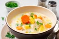 Creamy fish chowder soup in bowl on concrete background Royalty Free Stock Photo