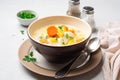 Creamy fish chowder soup in bowl on concrete background Royalty Free Stock Photo