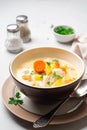 Creamy fish chowder soup in bowl on concrete background Royalty Free Stock Photo