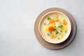 Creamy fish chowder soup in bowl on concrete background Royalty Free Stock Photo