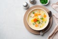 Creamy fish chowder soup in bowl on concrete background Royalty Free Stock Photo