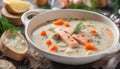 Creamy fish soup with salmon, potatoes, onions , carrots, dill and celery