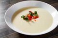 Creamy fish soup with salmon, potatoes, onions, cauliflower and carrots Royalty Free Stock Photo