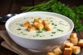 Creamy garlic soup topped with crispy golden croutons and finely chopped fresh chives Royalty Free Stock Photo