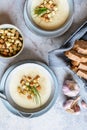 Creamy garlic soup topped with croutons and chives Royalty Free Stock Photo