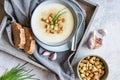 Creamy garlic soup topped with croutons and chives Royalty Free Stock Photo