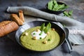 Creamy green pea soup with sour cream Royalty Free Stock Photo