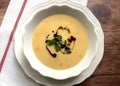 Creamy hokkaido pumpkin soup with pumpkin pieces.