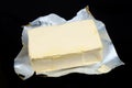 Creamy margarine in an industrial open foil packaging isolated macro Royalty Free Stock Photo