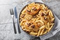 Creamy Marry Me Chicken pasta with sun-dried tomatoes, cheese, herbs and aromatic sauce close-up in a plate. Horizontal top view Royalty Free Stock Photo