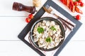 Creamy mushroom sauce with pieces of white mushrooms with spices in a frying pan. top view. white wooden background Royalty Free Stock Photo