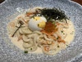 Creamy noodle topping with boiled egg.