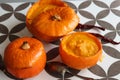 Creamy pumpkin soup and homemade bread on grey tiled table. Soup in a squash top view photo. Thanksgiving menu ideas.ÃÂ ÃÂ  Royalty Free Stock Photo