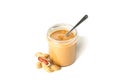 Creamy peanut butter in glass jar, peanut and spoon  on white background Royalty Free Stock Photo