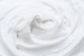 Creamy pic and waves in yoghurt or cream surface. Top view Royalty Free Stock Photo